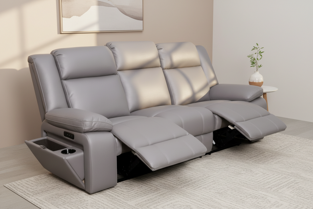 Gray reclining sofa with cup holders on a white background