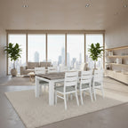 A white dining table set with six chairs, featuring a combination of white and multi-colored wooden elements on the table and chairs, with metal handles.